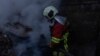 Ukraine -- Rescue workers at the site of Russian strike, Kyiv, 7Apr2025